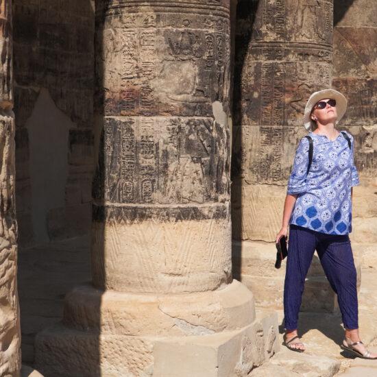 Walking through the columns of Philae Temple in Aswan during Egypt 6 Days Tour