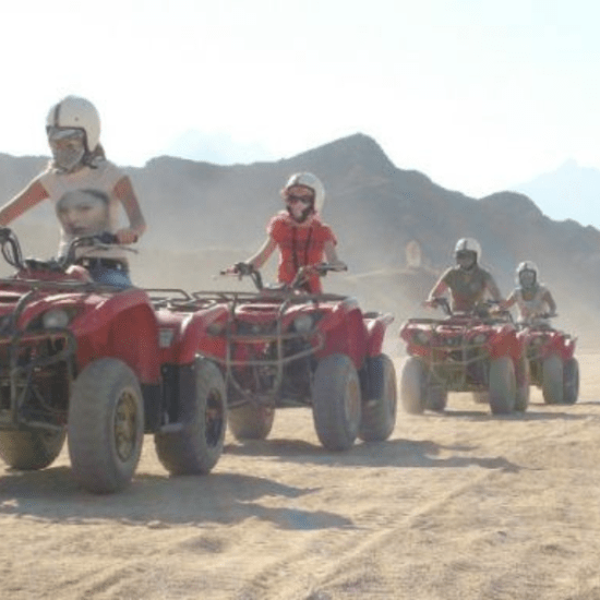 Tourists on quad bikes at Giza Pyramids