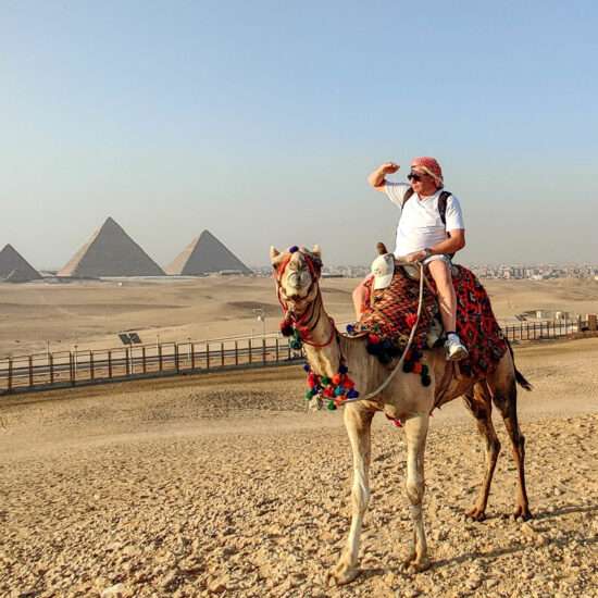 Camel ride at Giza Pyramids in Cairo Egypt