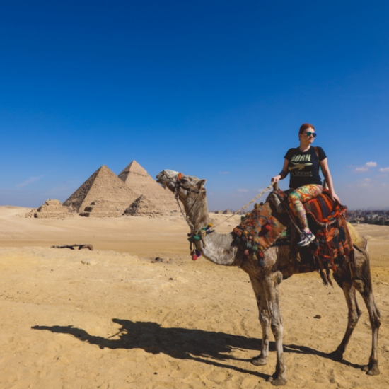 14 Days Egypt Adventure Tour Package - Majestic Giza Pyramids towering under a clear sky.
