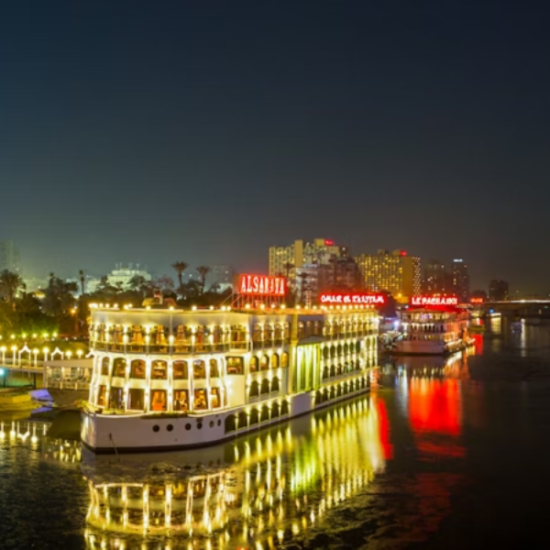 Nile River Dinner Cruise with Cairo skyline in the background - 12 Days Cairo, Nile Cruise, Hurghada & Bahariya Oasis Tour