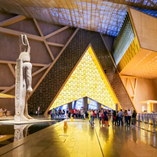12 Days Cairo, Hurghada, Nile Cruise & Sahara - The Grand Egyptian Museum with ancient artifacts on display.