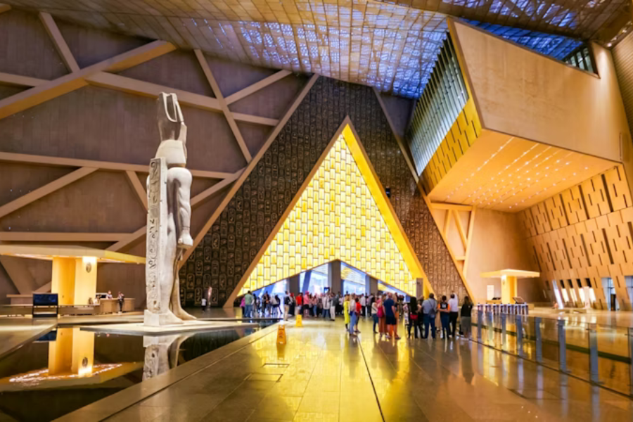 12 Days Cairo, Hurghada, Nile Cruise & Sahara - The Grand Egyptian Museum with ancient artifacts on display.