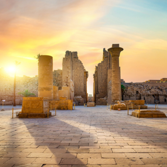Luxor Temple, illuminated against the desert sky.