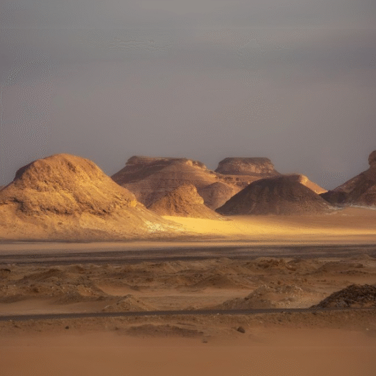Volcanic hills and black stones in the Black Desert, Egypt.