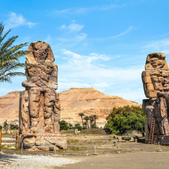 The Colossi of Memnon stand tall as timeless guardians of ancient Thebes.