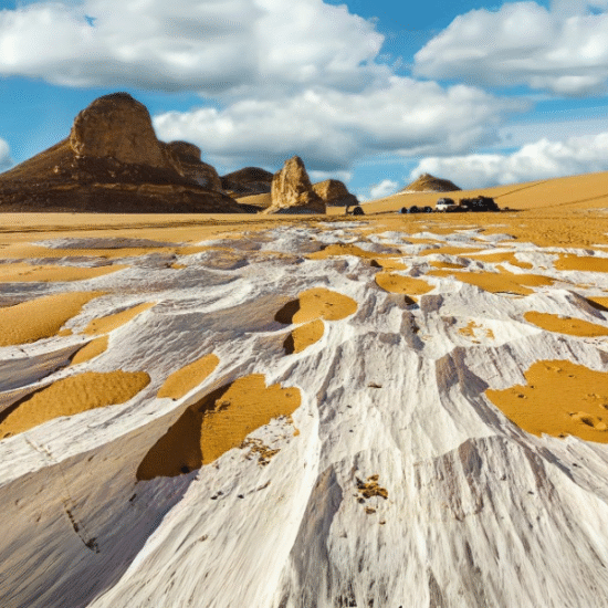 Unique rock formations in the White Desert, Egypt, under a clear blue sky.