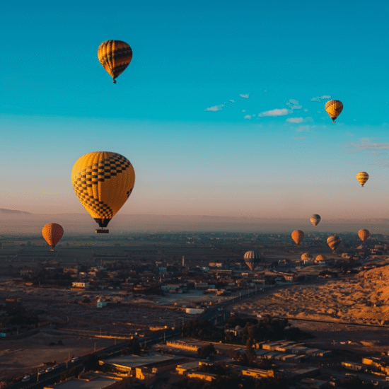 Luxor balloon adventure at sunrise with travelers on board - Hot Air Balloon Ride in Luxor