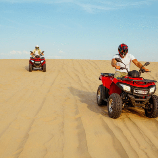 4x4 jeep driving through sand dunes during a desert safari in Hurghada, Egypt.