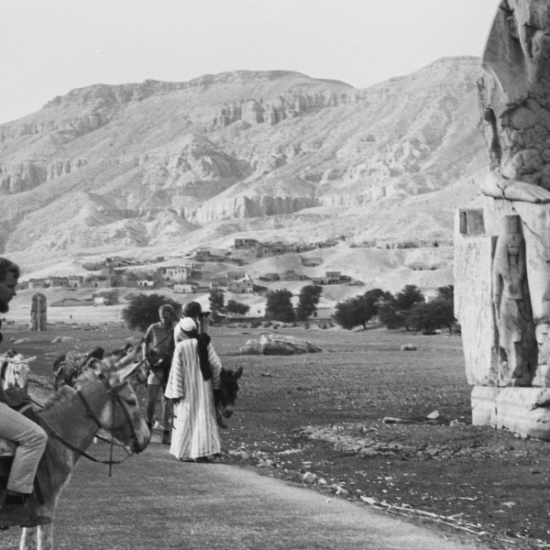 Colossi of Memnon Luxor Egypt two massive stone statues of Pharaoh Amenhotep III.