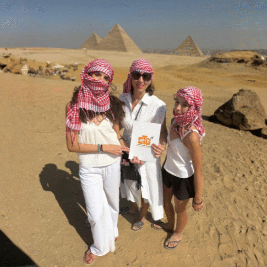 Three female tourists from our company visiting the Great Pyramids of Giza.