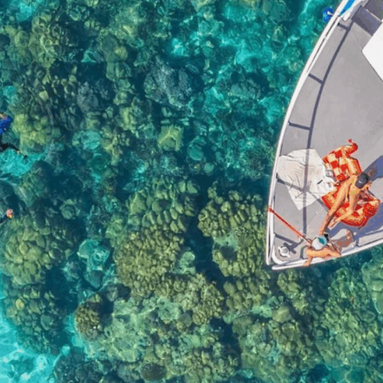 Tourists snorkeling from a boat in the Red Sea near Hurghada, Egypt.