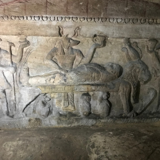 An elderly man visiting Kom El Shoqafa Catacombs in Alexandria