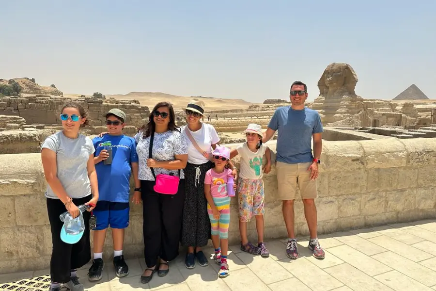 Family visiting the Pyramids of Giza, Cairo Egypt