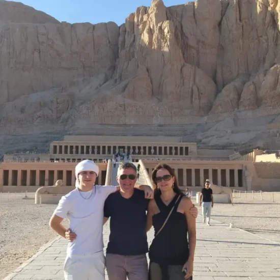 A family standing in front of Hatshepsut Temple in Luxor