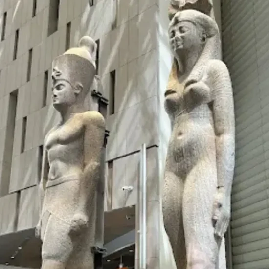 Large ancient Egyptian statues inside the Grand Egyptian Museum