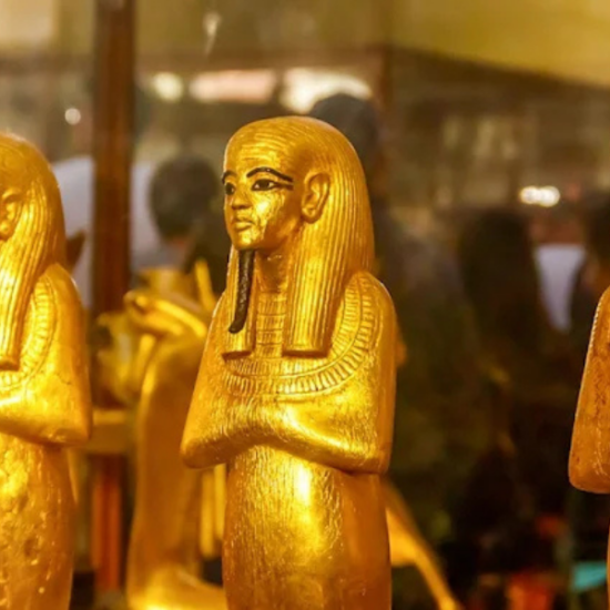 Small ancient statues displayed at the Grand Egyptian Museum